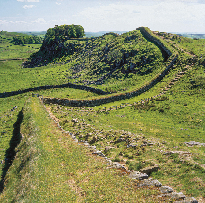 Enlargeable photo of a green landscape showing a long man-made wall