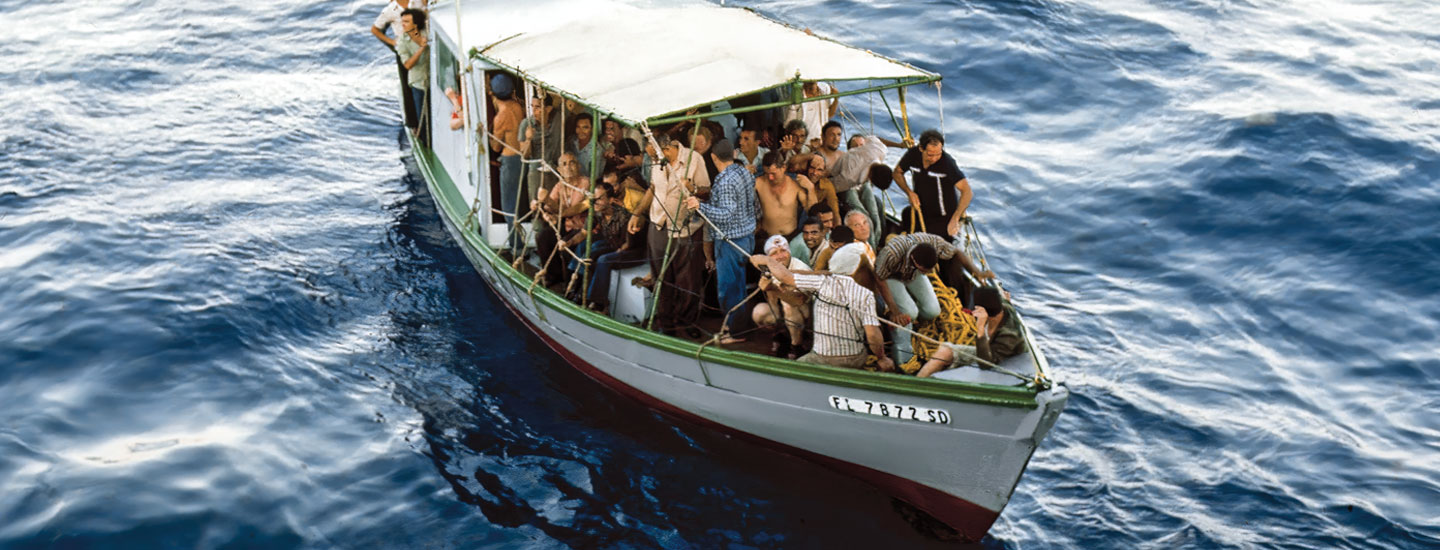 Bird's eye view of a small boat packed with people