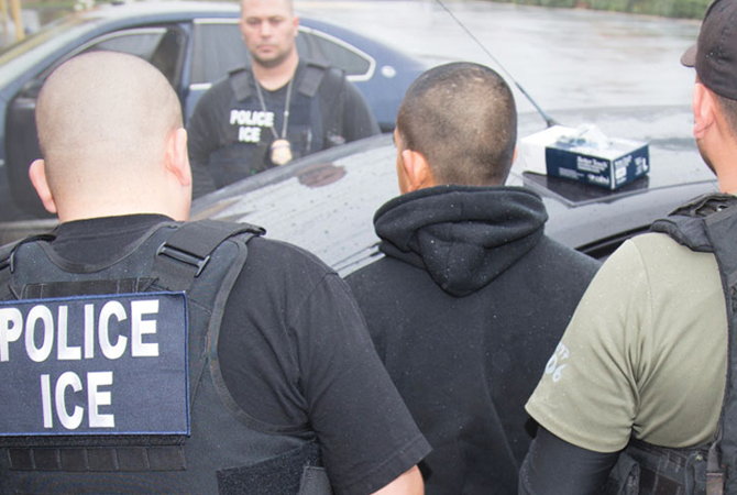 Police detaining a young man