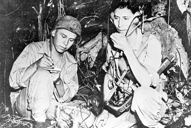 A soldier taking notes from a civilian